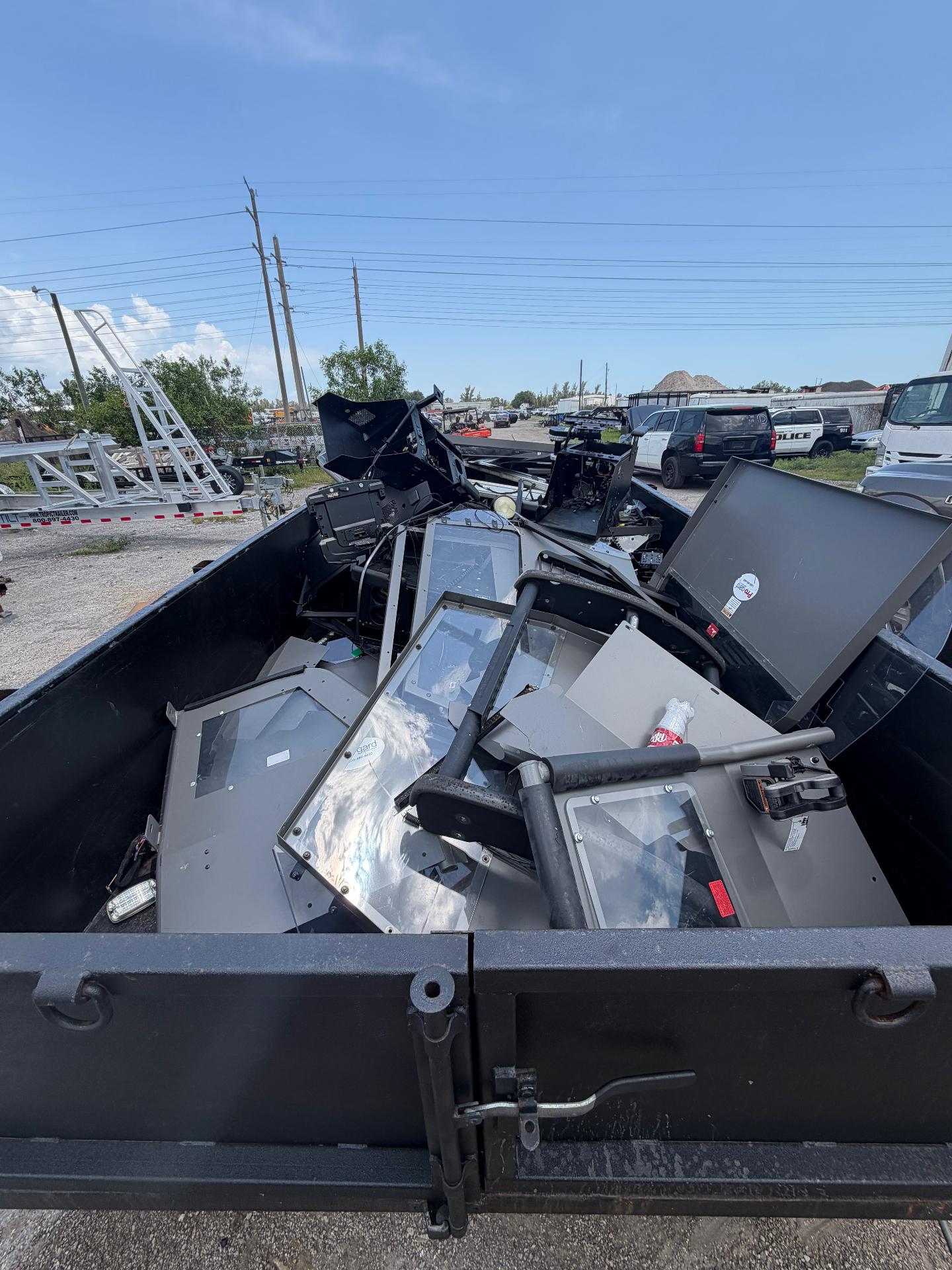Dump trailer filled with commercial electronics and equipment for removal