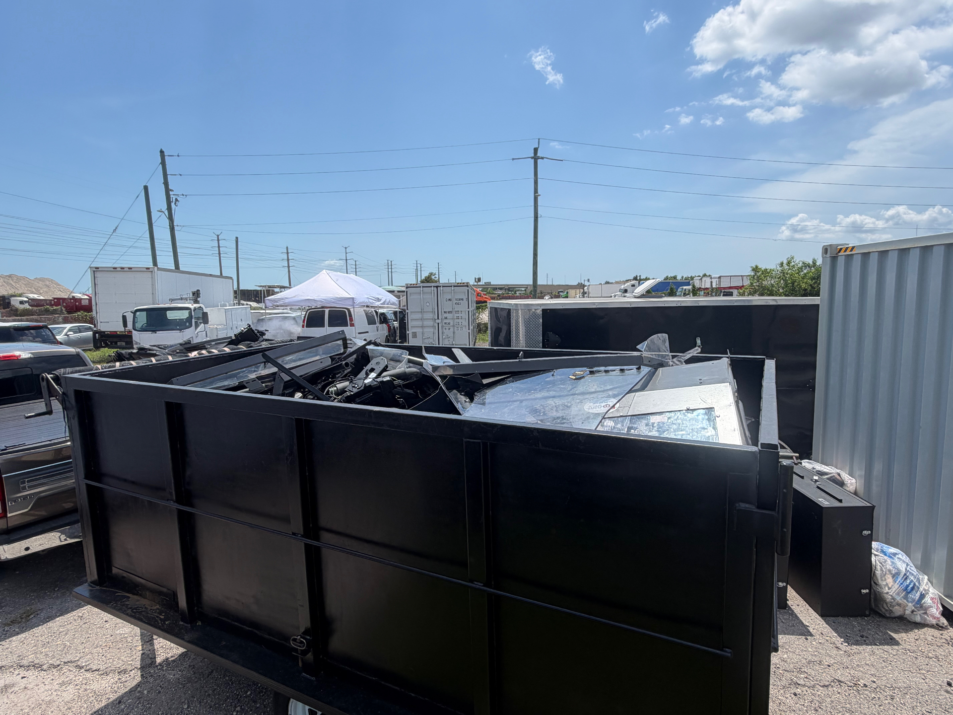 Dump trailer loaded with scrap metal and electronics ready for disposal